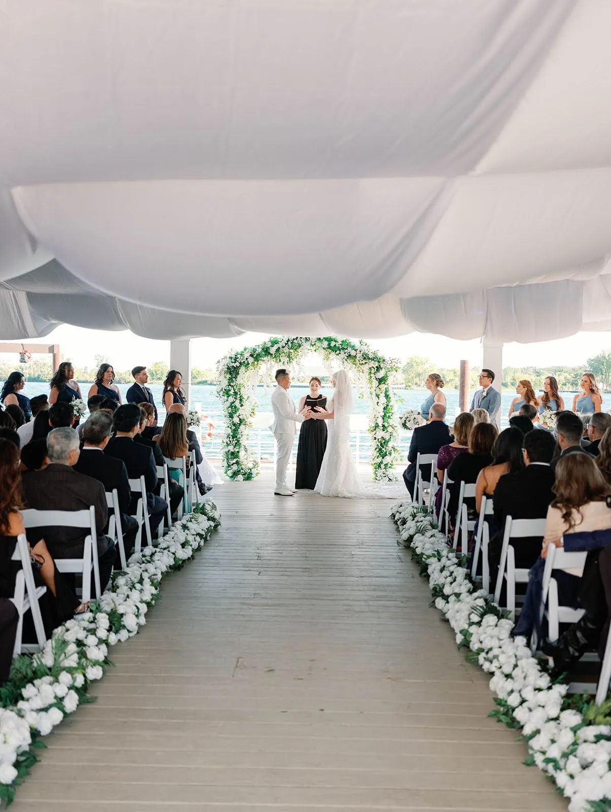Waterfront wedding ceremony aisle at the Roostertail