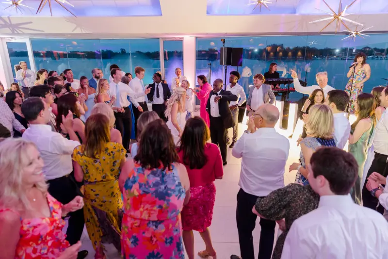 Packed dance floor over the water