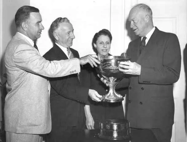Bill Cantrell, Joe and Millie Schoenith at the White House with President Dwight Eisenhower, who holds the President's Cup.