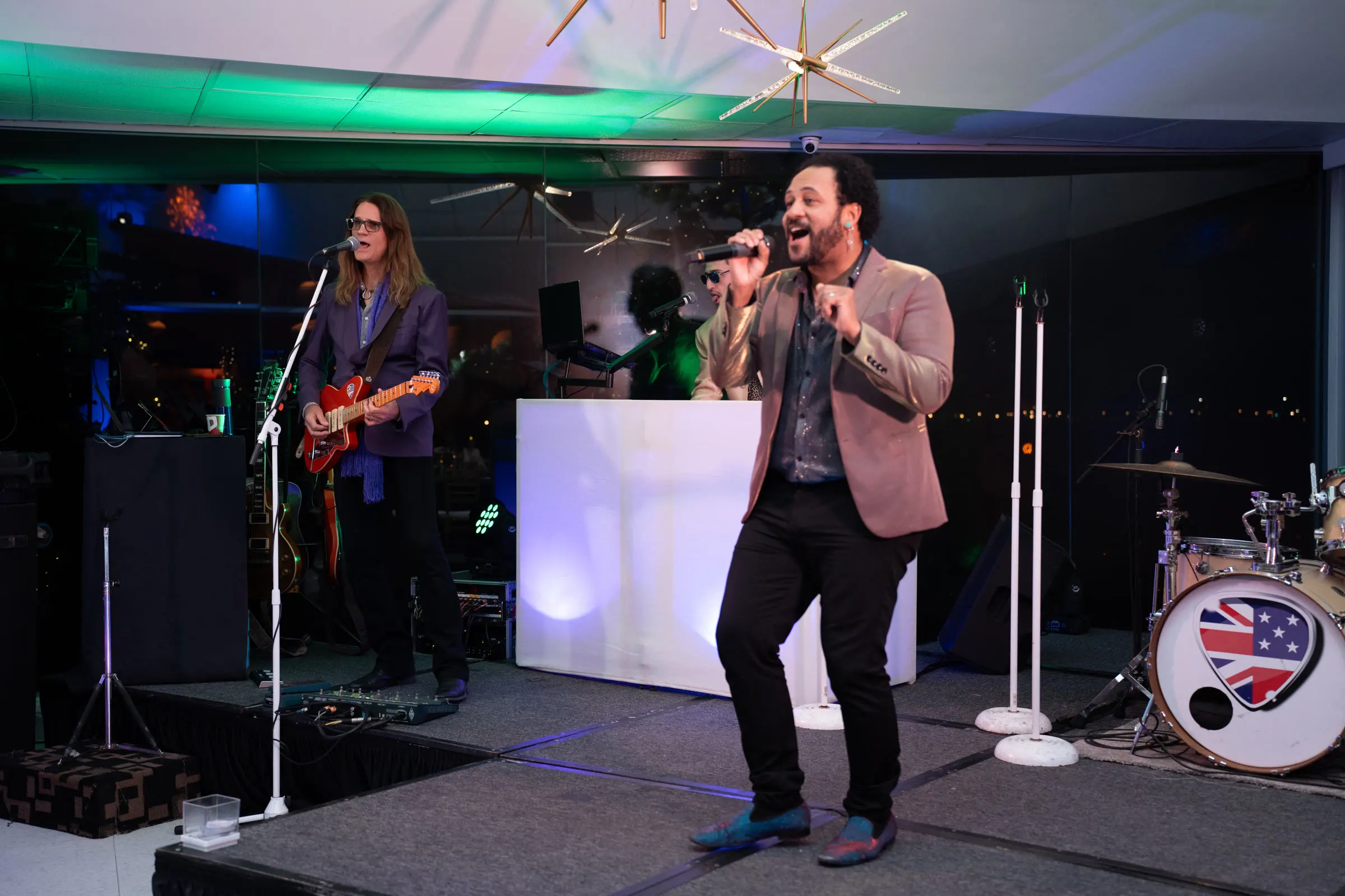 A live band playing on stage at a company holiday party