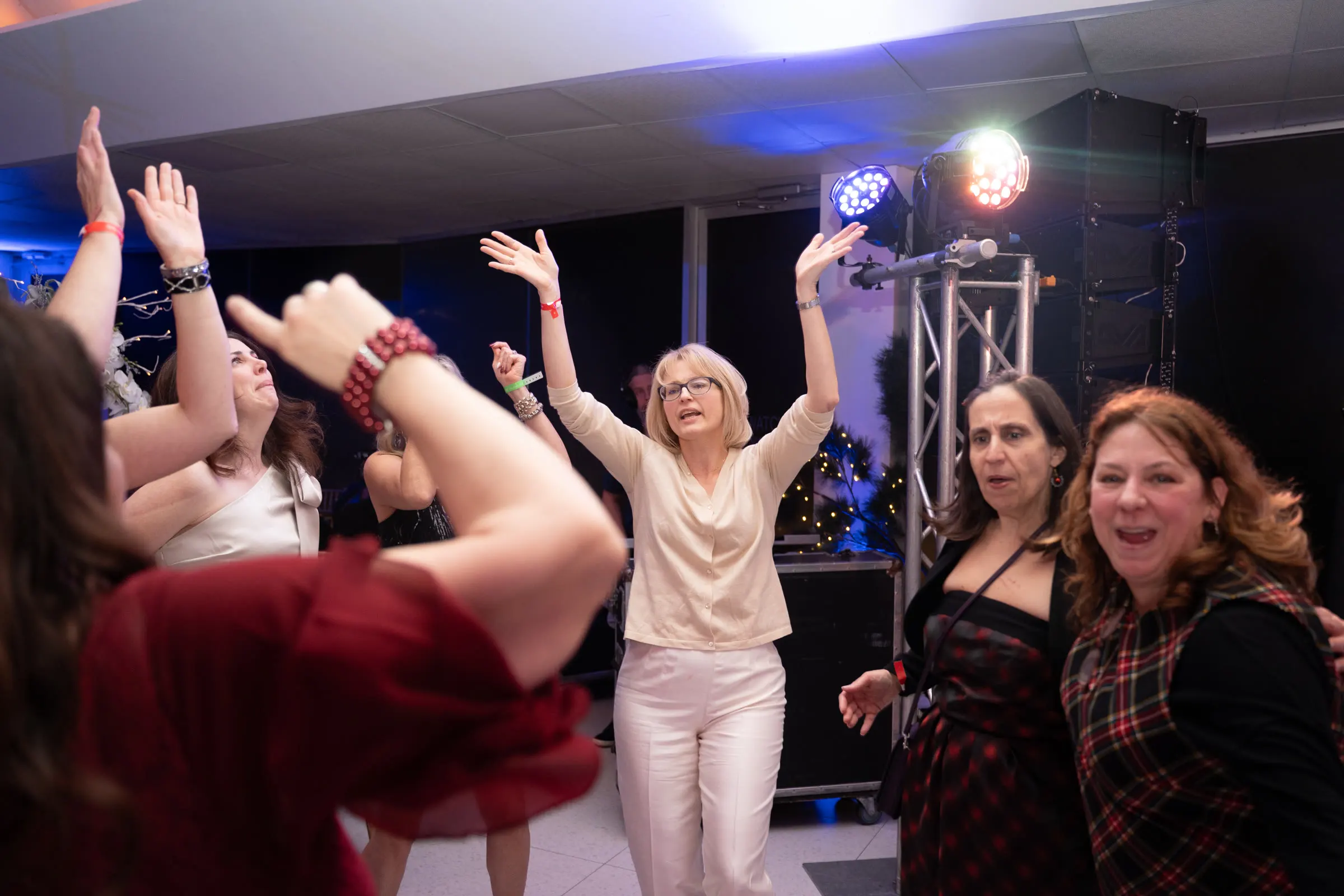 Guests dancing at an office holiday party