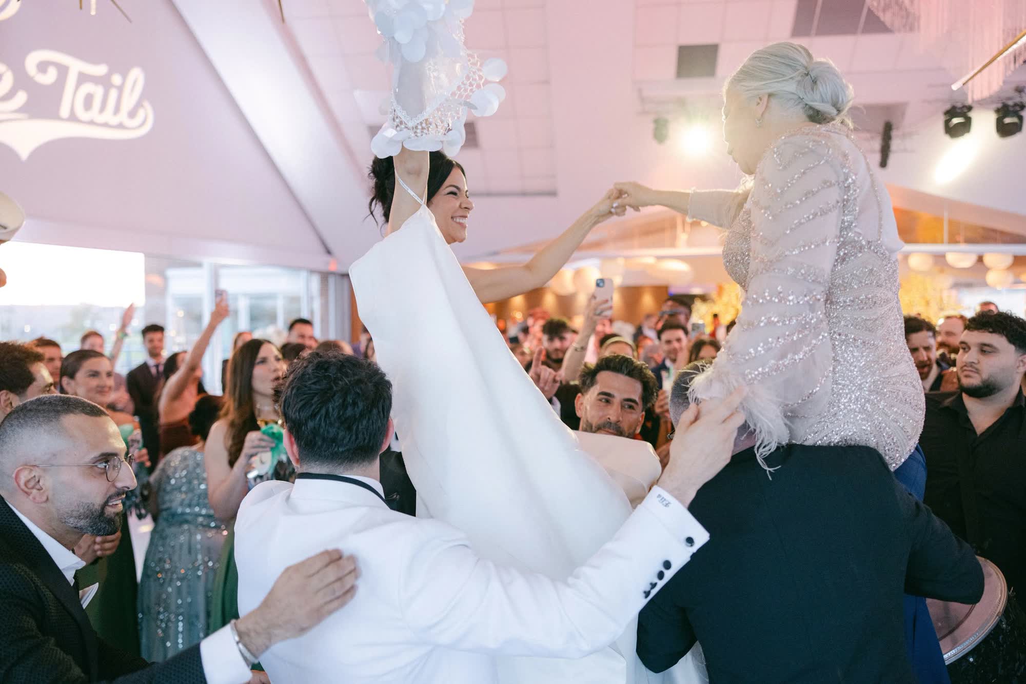 Detroit wedding venue hora chair dance, Weddings at The Roostertail, Detroit